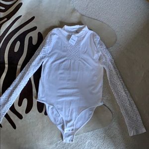 Never been worn Free People bodysuit. Tags on!!